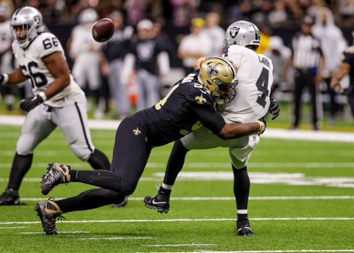 New Orleans Saints defensive end Cameron Jordan (94) hits Las Vegas Raiders quarterback Derek Carr (4) as he throws the football. Mandatory Credit: Stephen Lew-USA TODAY Sports